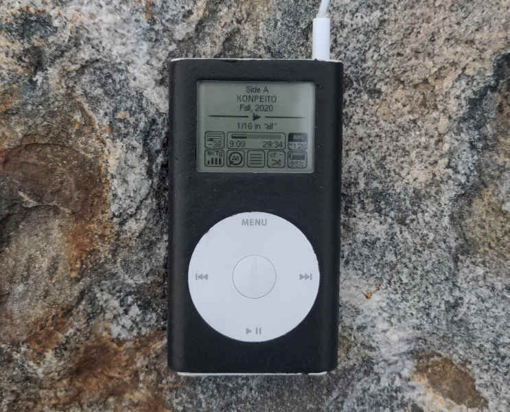 The finished Ipod Mini laying on a grey rock.